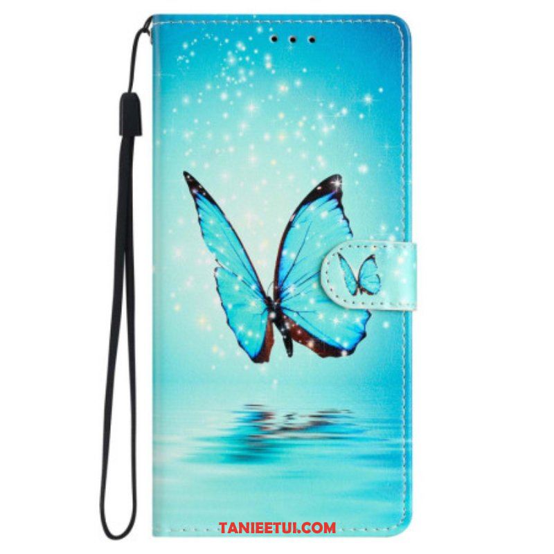 Etui Folio do iPhone 15 z Łańcuch Niebieski Motyl W Locie Z Paskiem